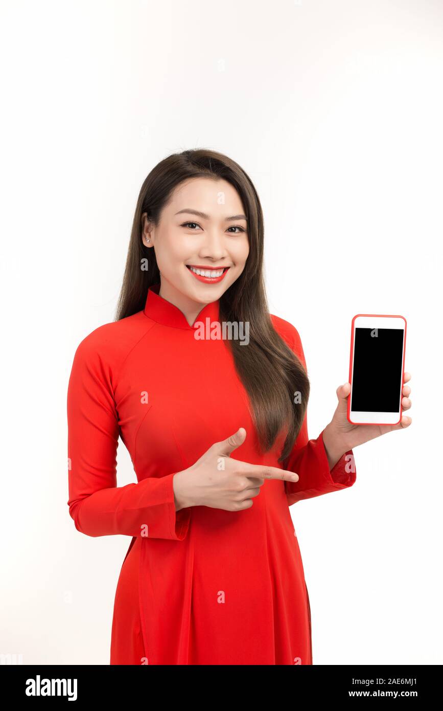 Asian Woman Shocked Product Sale of Vietnamese New Year Day Shopping Online on Mobile or Smartphone. Stock Photo