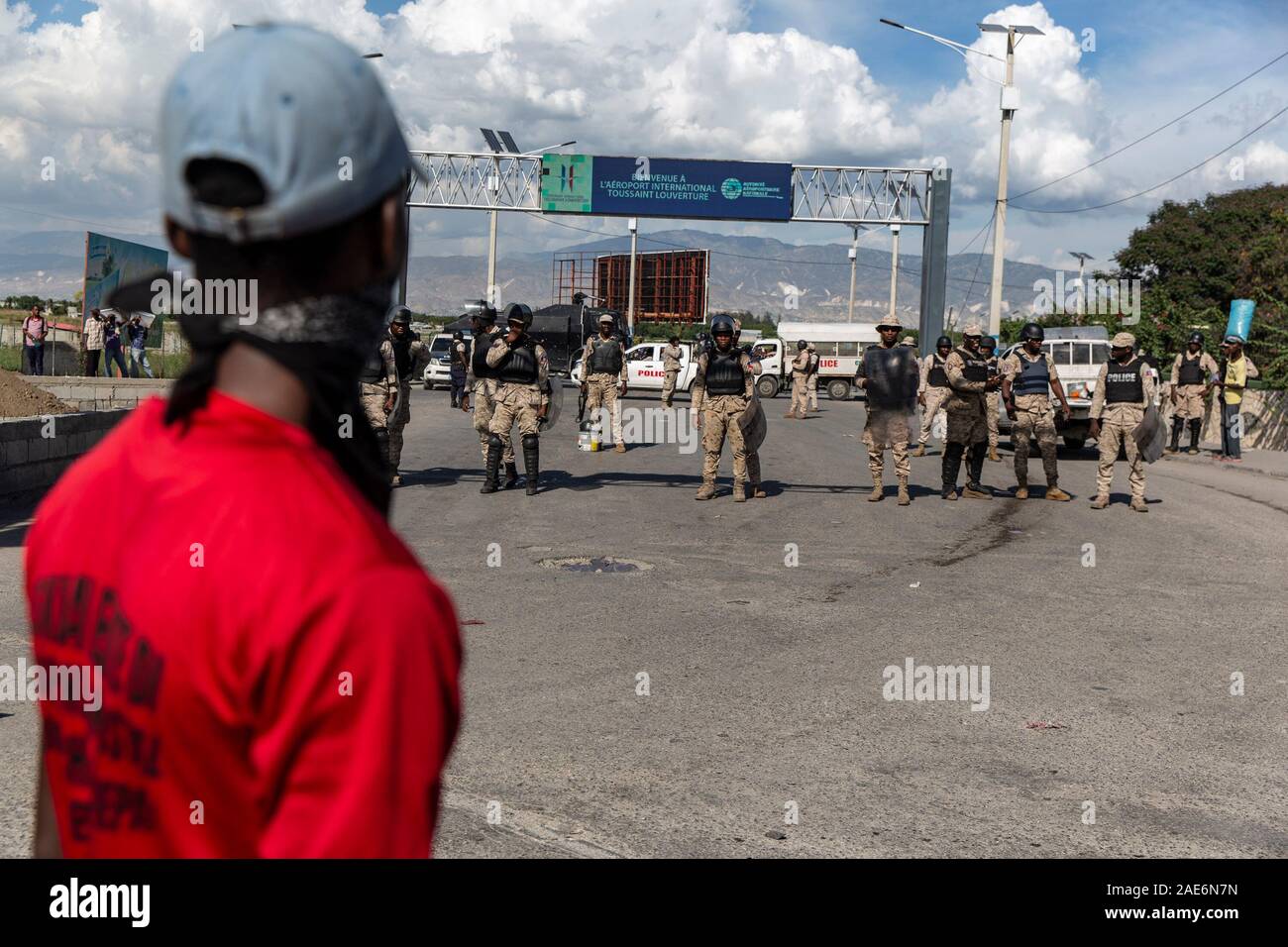 Port Au Prince, Haiti. 06th Dec, 2019. Police officers blockade the entrance to Toussaint Loverture Airport during the protest.For over a year tensions has been high in Haiti, widespread governmental corruption and the misuse of Venezuelan loans through the Petro Caribe program has led many people to take to the streets demanding that President Jovenel Moïse steps down. Country wide protests and the threat of violence has brought the nation to a near standstill with many businesses and schools have now been shuttered for months. With both sides digging in there seems no end in sight. Credit: S Stock Photo