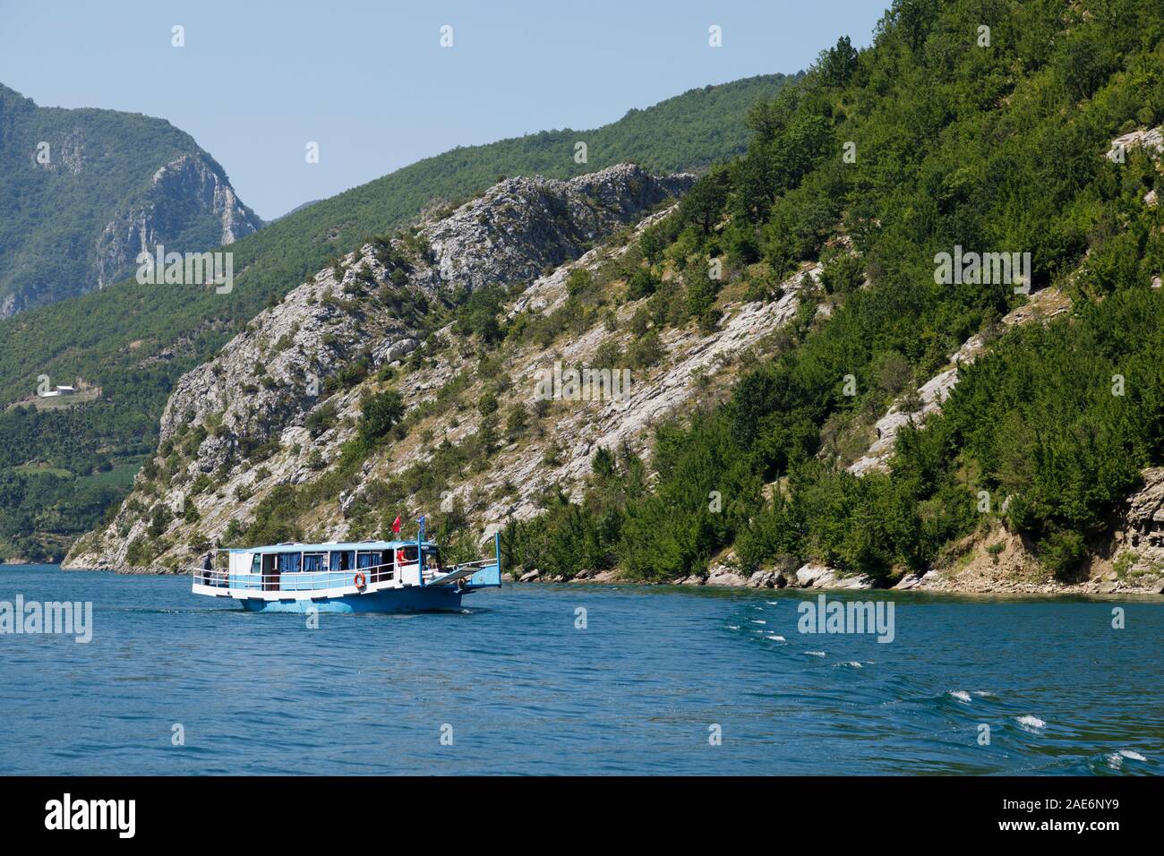 Koman, Albania, July 7 2019: An oncoming tourist boat on the Komani lake in the dinaric alps of Albania Stock Photo