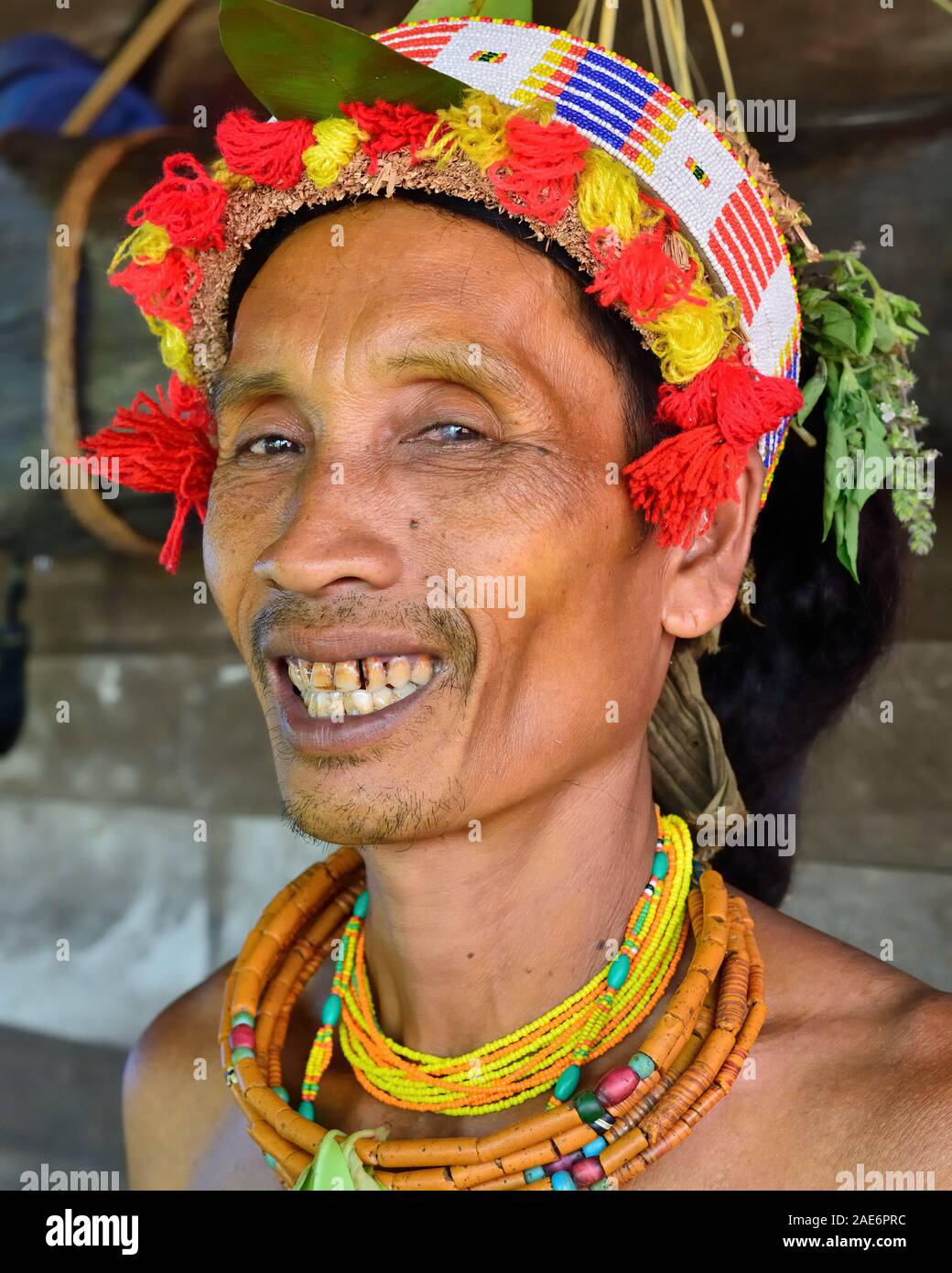Muara Siberut, Mentawai Islands, Indonesia, 3 NOVEMBER 2019: Portrait  tribal men - shaman, with traditional tattoos, at his rainforest home Uma, duri Stock Photo