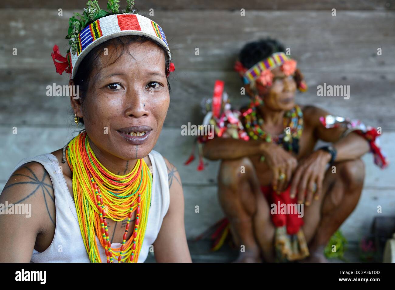 Muara Siberut, Mentawai Islands, Indonesia, 3 NOVEMBER 2019: Portrait  tribal woman - shaman, with traditional tattoos, at his rainforest home Uma, du Stock Photo