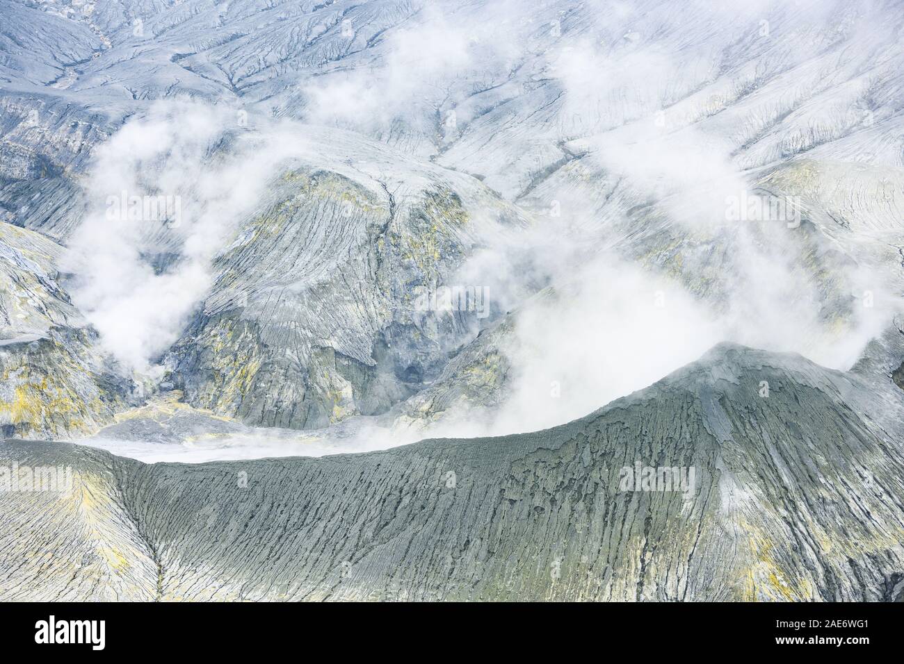 (Selective focus) Close-up view of the Tangkuban Perahu volcano with clouds of gases raising from the crater. Stock Photo