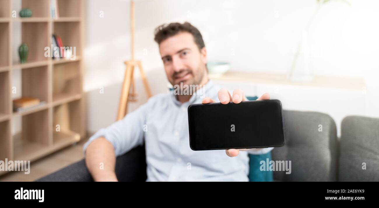 Man Showing Mobile Phone Display And Black Screen Copy Space For