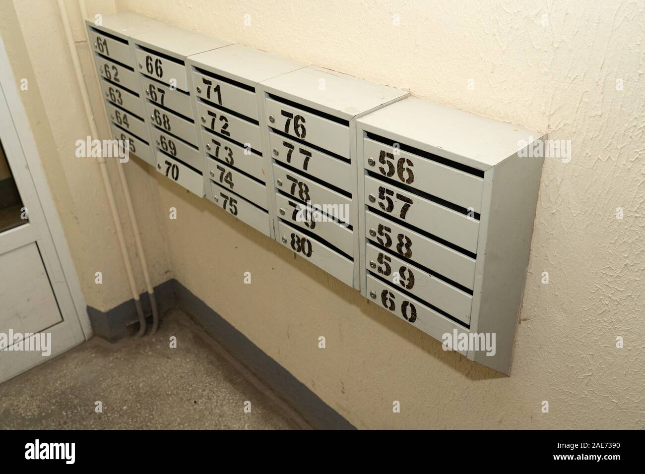 Mailboxes in a residential apartment building. Apartment numbers on