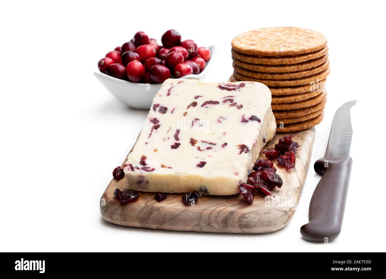 Cranberry cheddar cheese with wheat crackers isolated on white Stock