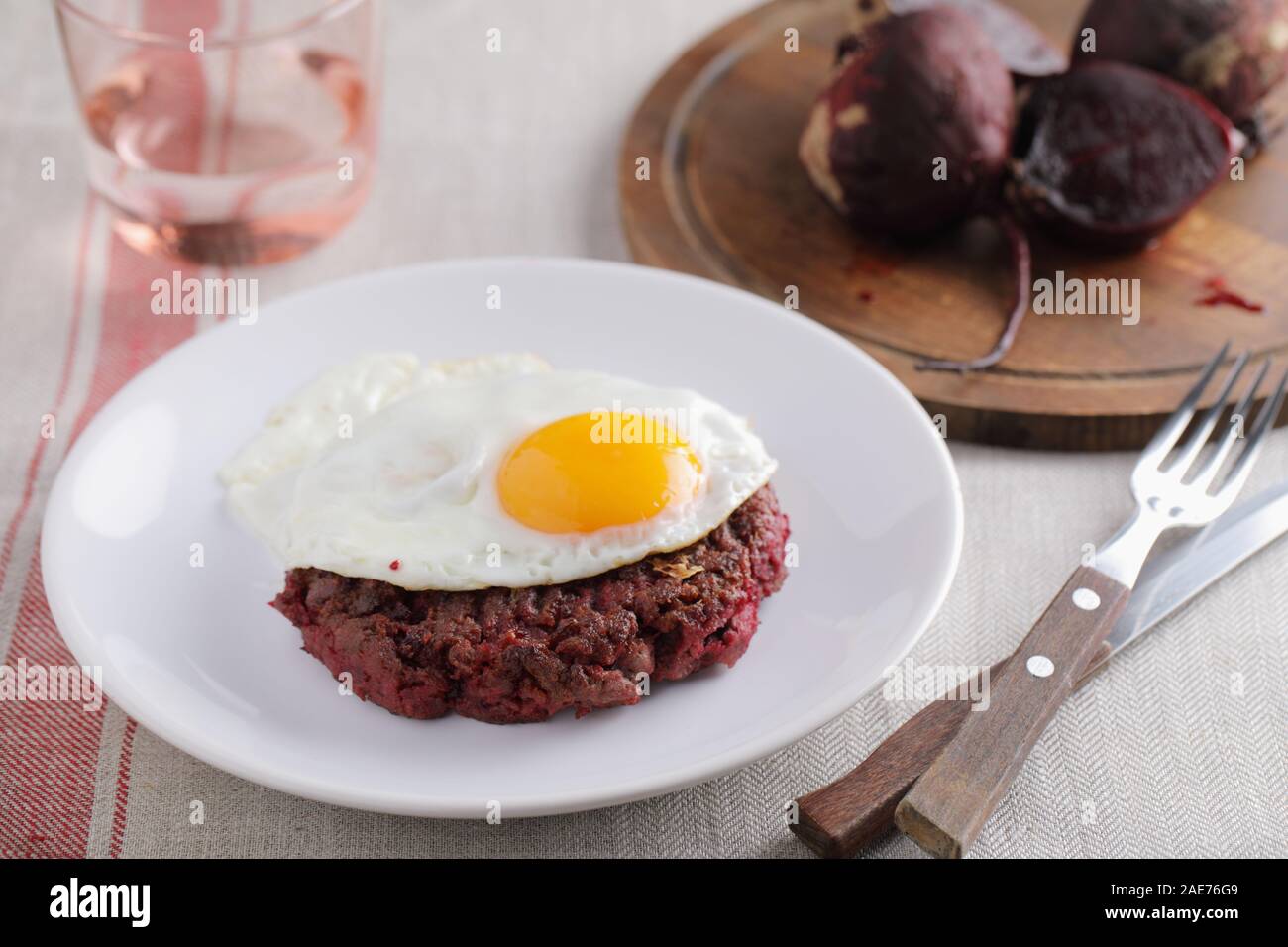 Swedish beef burger Biff a la Lindstrom with fried egg Stock Photo - Alamy