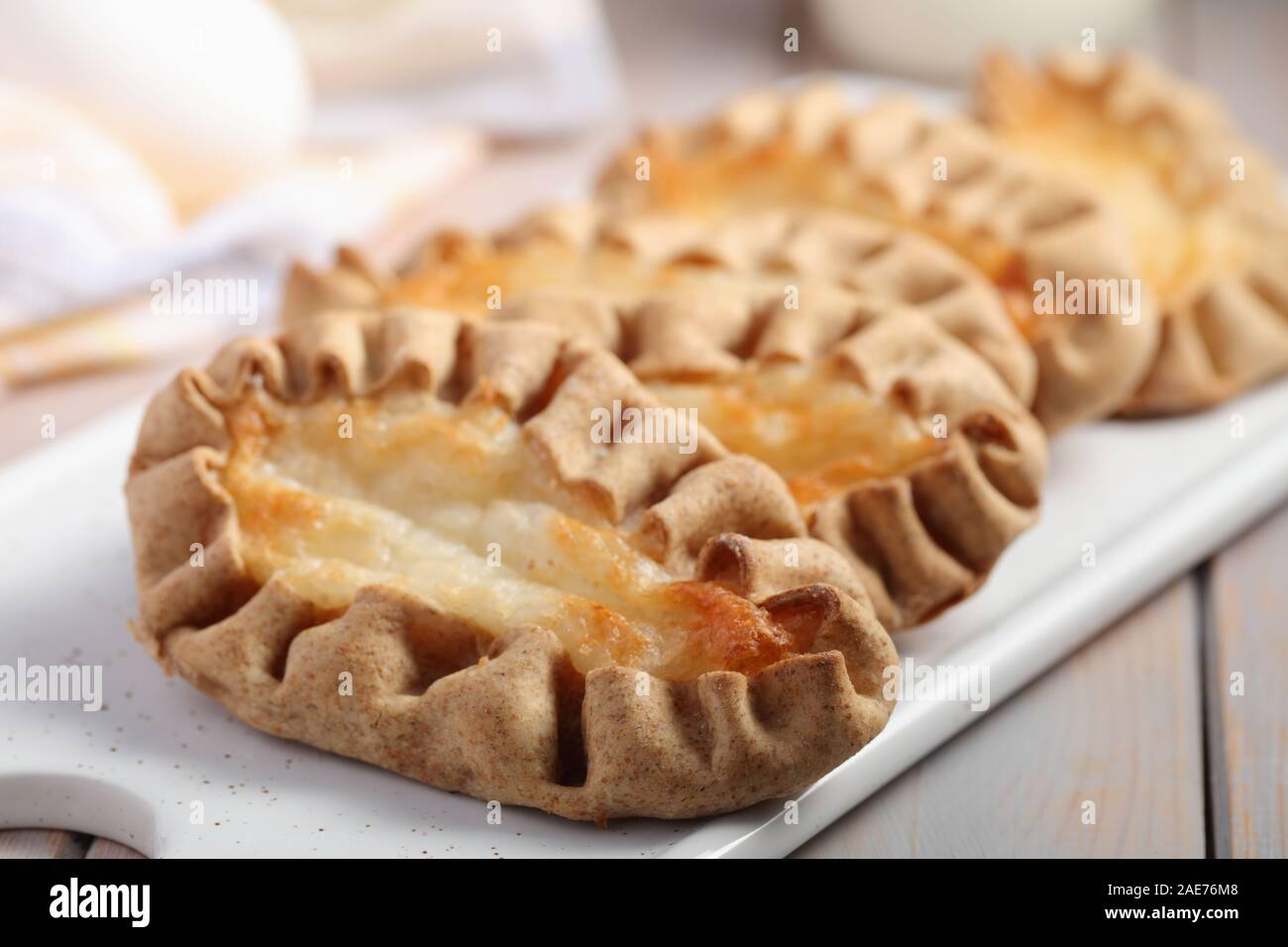 Karjalanpiirakat, Karelian pasties on a cutting board. Today it is a national dish in Finland Stock Photo