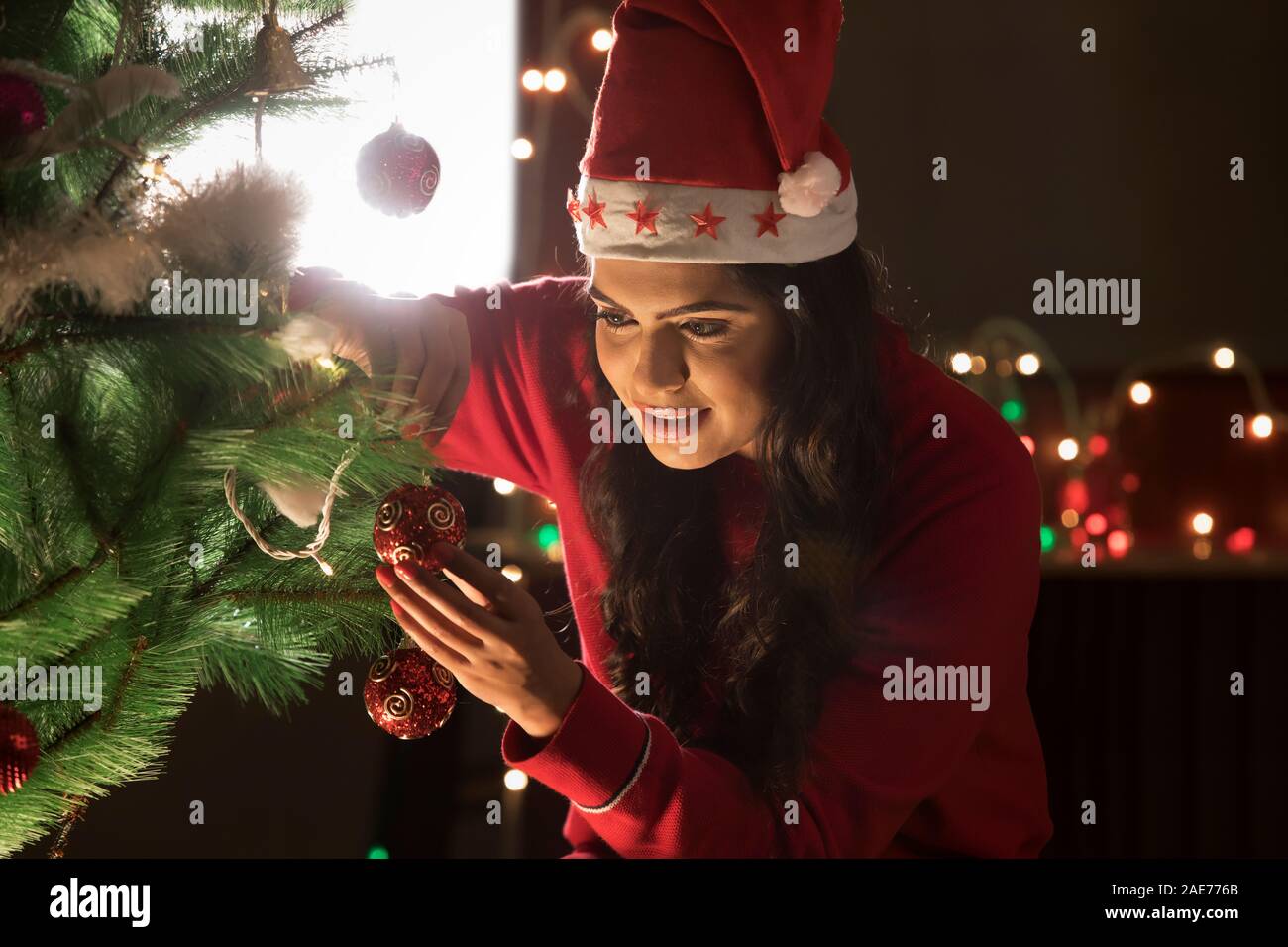 Indian woman smiling christmas tree hi-res stock photography and images ...