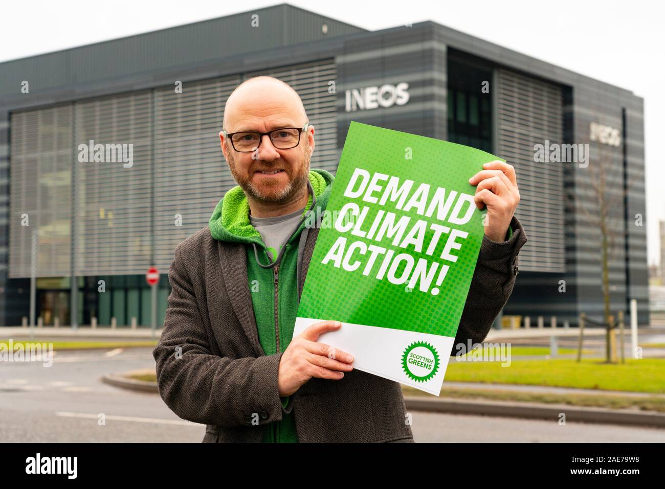 Grangemouth, Scotland, UK. 7th December 2019. Scottish Greens co-leader Patrick Harvie joined Linlithgow and East Falkirk candidate Gillian Mackay for a demonstration outside INEOS offices in Grangemouth. The refinery operated there by INEOS is ScotlandÕs biggest polluter according to the Greens. The Scottish Greens are calling for the end of shale gas imports, which bring fracked gas from the US to Grangemouth. Pictured; Patrick Harvie. Iain Masterton/Alamy Live News Stock Photo