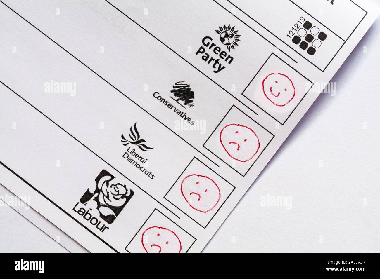 Spoiled spoilt ballot paper for forthcoming Parliamentary Election 2019 in UK - wasted vote smiley face emoji against Green Party with unhappy face Stock Photo