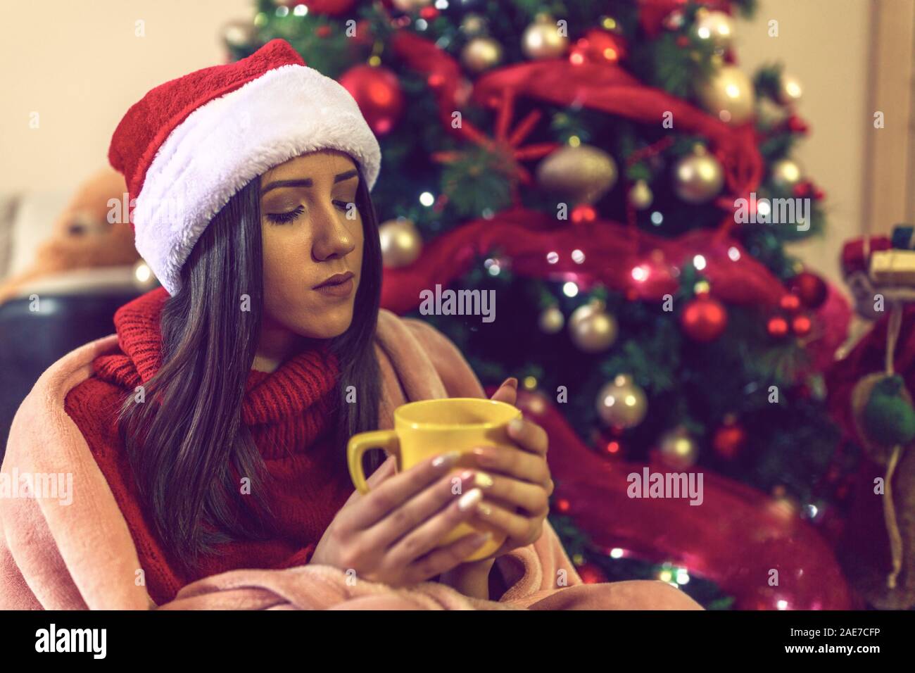 Happy girl drinking coffee in christmas at home Stock Photo