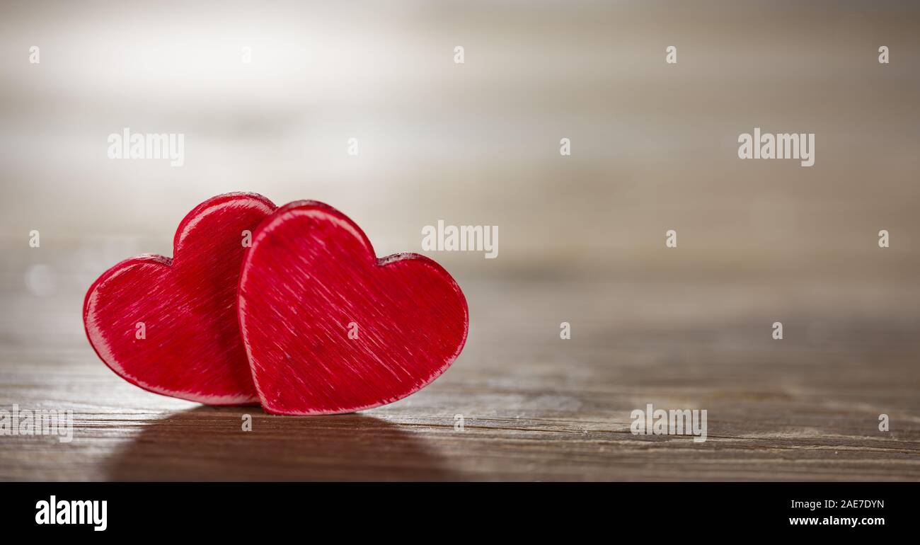 Two hearts on panoramic black wooden background Stock Photo