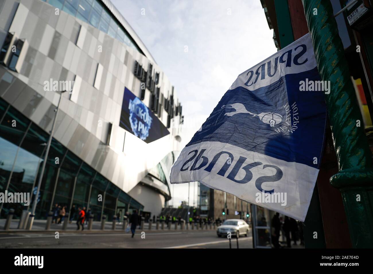 Tottenham Hotspur Stadium, London, UK.   7th Dec, 2019. English Premier League Football, Tottenham Hotspur versus Burnley; Spurs flag waving outside a local restaurant with Tottenham Hotspur Stadium in the background - Strictly Editorial Use Only. No use with unauthorized audio, video, data, fixture lists, club/league logos or 'live' services. Online in-match use limited to 120 images, no video emulation. No use in betting, games or single club/league/player publications Credit: Action Plus Sports/Alamy Live News Stock Photo