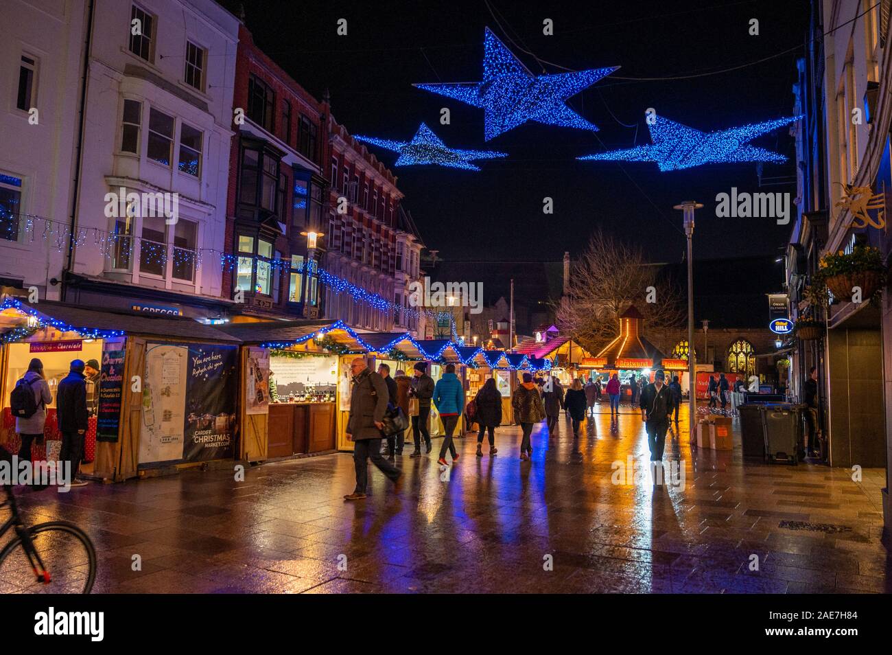 The Christmas market and lights on St John Street Cardiff in the lead