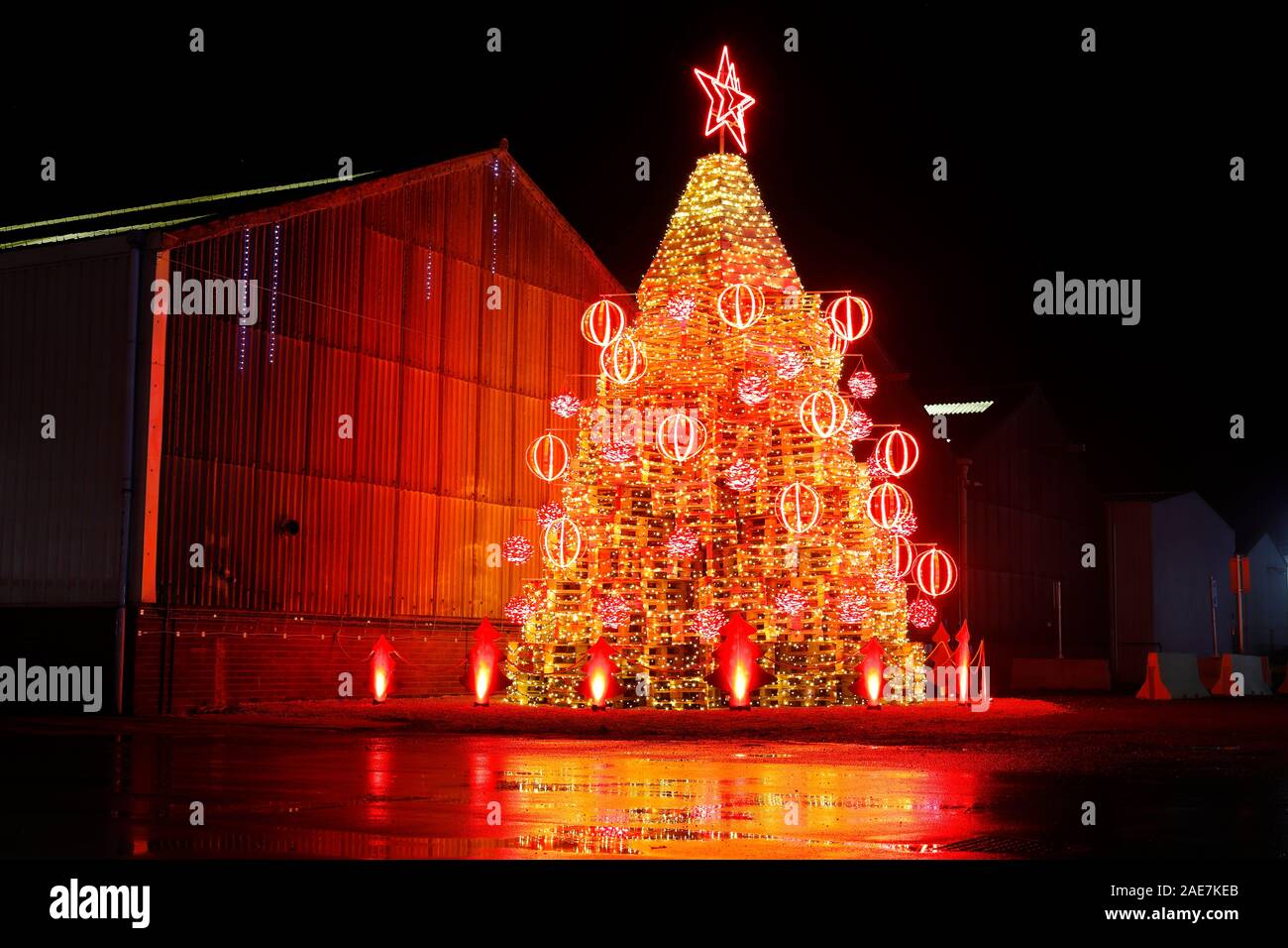 Denison Christmas Lights 2022 An Innovative Christmas Tree, Made From Pallets Of Wood. This Is Located At  The Entrance To Sedamyl Uk In Selby,North Yorkshire Stock Photo - Alamy