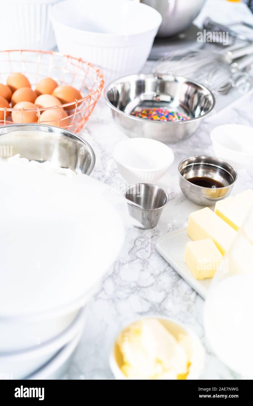 Ingredients to bake funfetti cake with colorful sprinkles Stock Photo