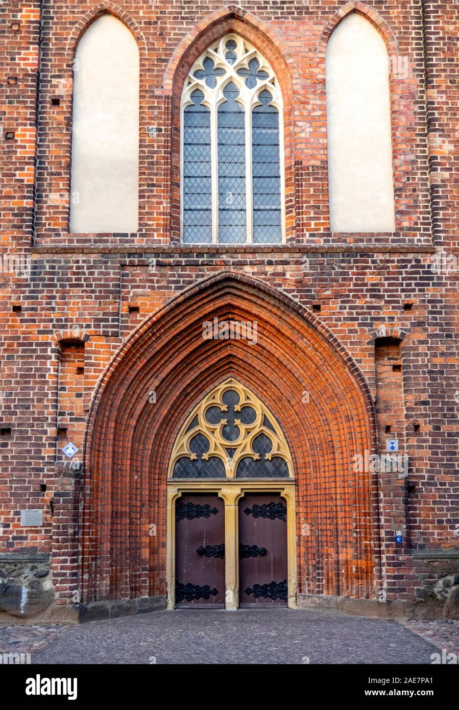 Brick Gothic arched windows and doorway of St Stephens Church Stephanskirche in Tangermünde Saxony-Anhalt Germany. Stock Photo