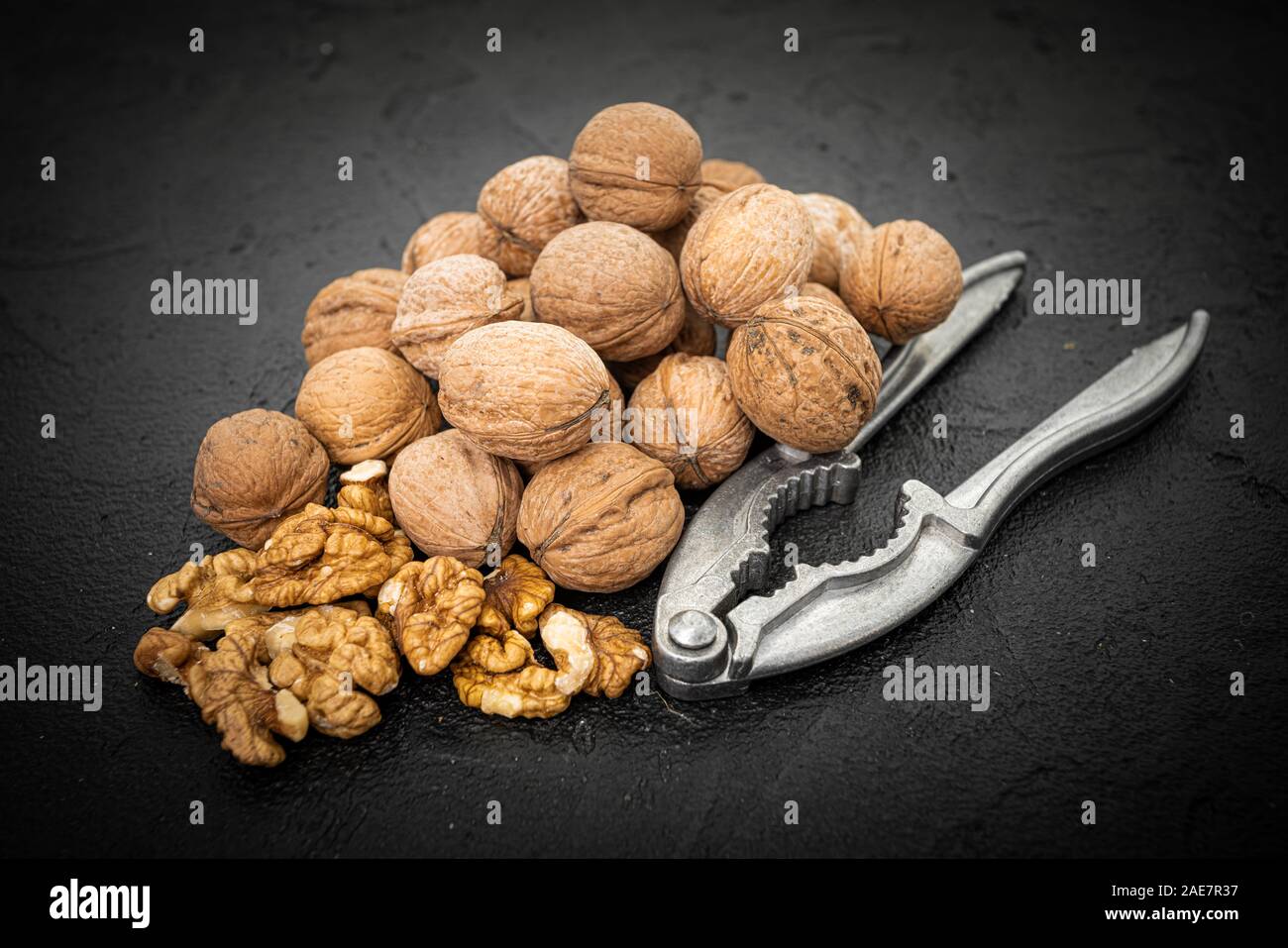 Walnut on over black slate stone background Stock Photo