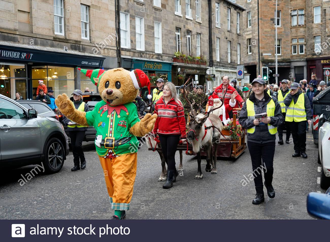 Edinburgh, Scotland, UK. 7th  Dec 2019.  Christmas Charity Festival in Stockbridge Edinburgh, the festival starts with the Santa Parade led by the Stockbridge Pipe Band, followed by santa and his reindeer, the route ends in Inverleith Park. Santa on his sleigh in Raeburn Place. Credit: Craig Brown/Alamy Live News Stock Photo