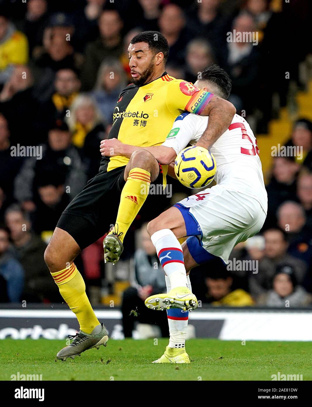 Watford's Troy Deeney and Crystal Palace's Martin Kelly (right) battle for the ball during the Premier League match at Vicarage Road, Watford. Stock Photo