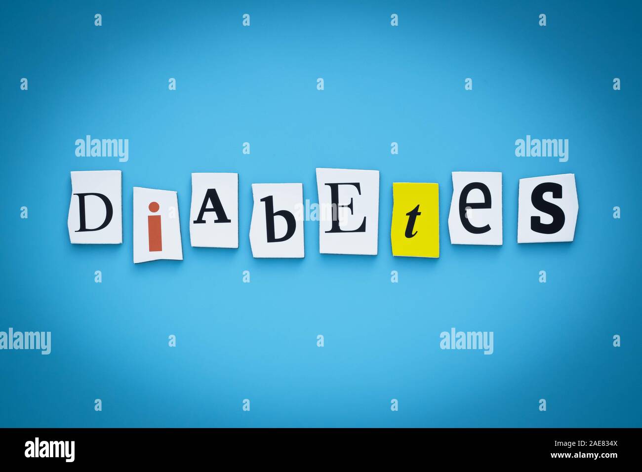 Text - diabetes. Single word. Cut paper letters on blue background ...