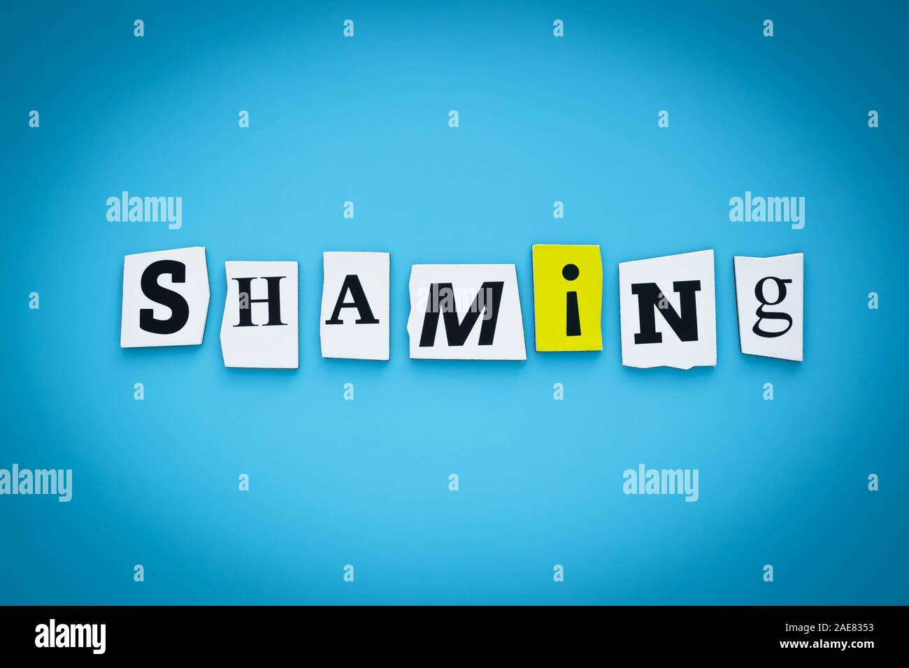 Scheeming Text Text - shaming. Single word. Cut paper letters on blue background ...