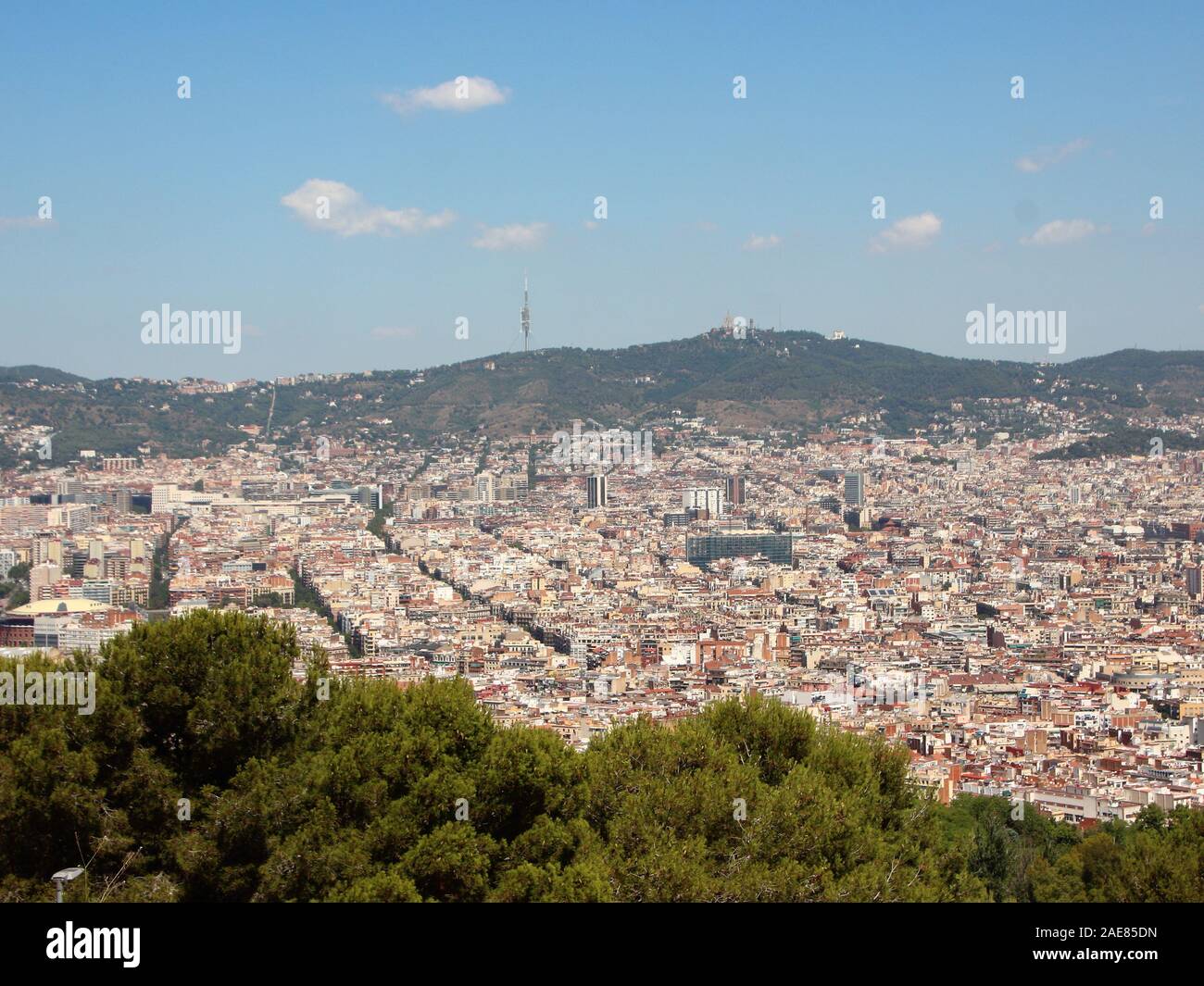 Mountain Ponaramic View with Sagrada Familia Barcelona in Background. Smog is hiding the mountains. Stock Photo