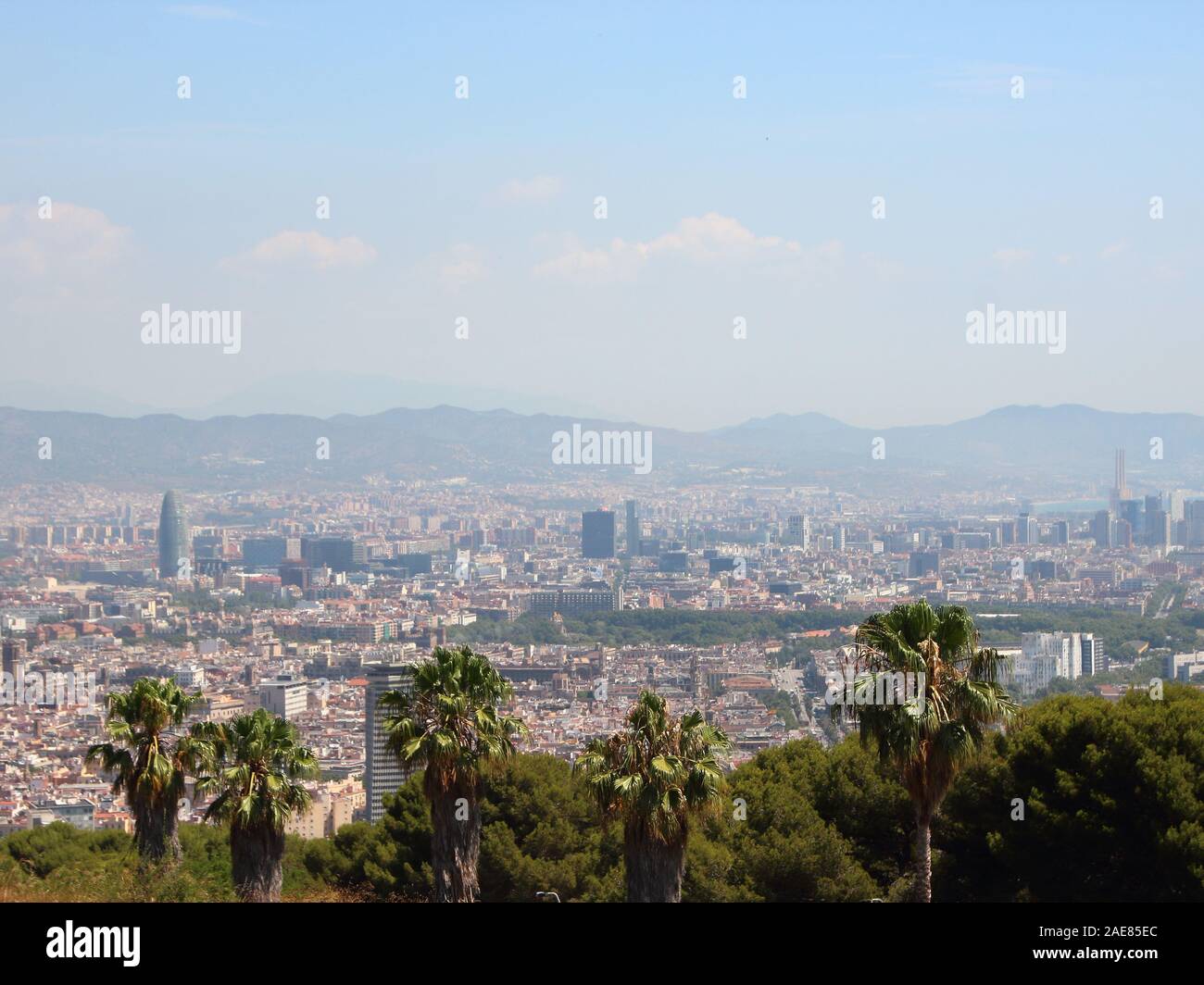Mountain Panoramic View with Sagrada Familia Barcelona in Background. Smog is hiding the mountains. Stock Photo