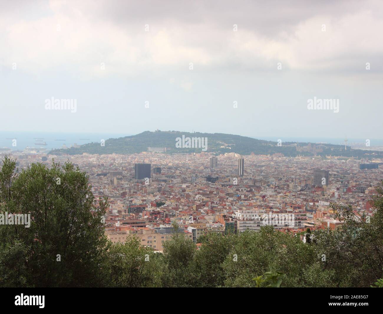 City view Horizon over Barcelona Spain with Mountain Montjuïc Background. Tranquil parc area. Stock Photo