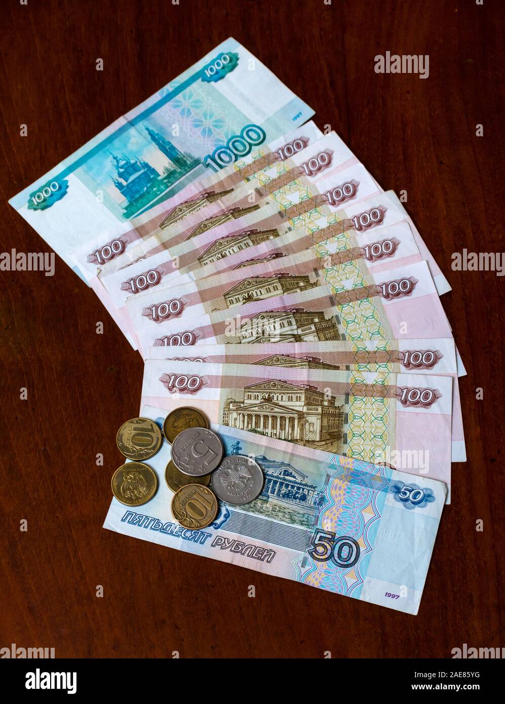 Russian rouble or ruble banknotes & coins with one thousand (1000) one hundred (100) and fifty (50) roubles Stock Photo