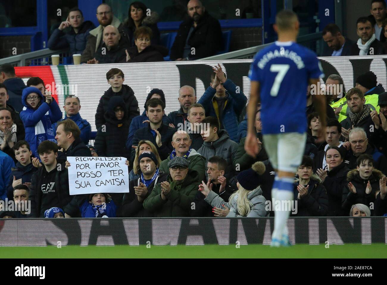 Liverpool, UK. 07th Dec, 2019.Liverpool, UK. 07th Dec, 2019. A young  Everton fan holds a sign written in Portuguese asking for Richarlison of  EvertonÕs shirt . Premier League match, Everton v Chelsea