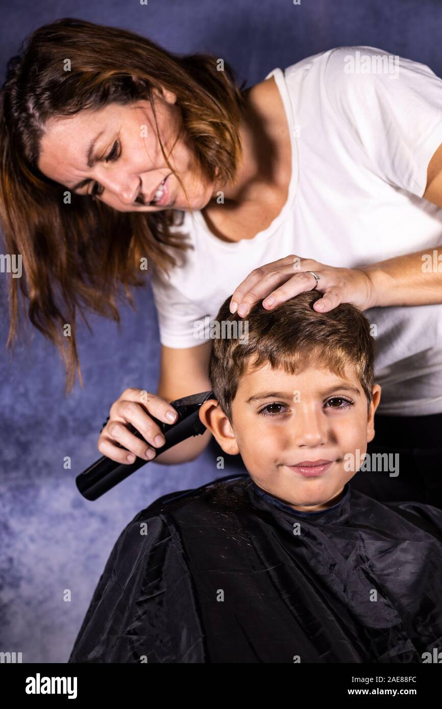 Little boy getting a haircut with a cutting machine Stock Photo Alamy