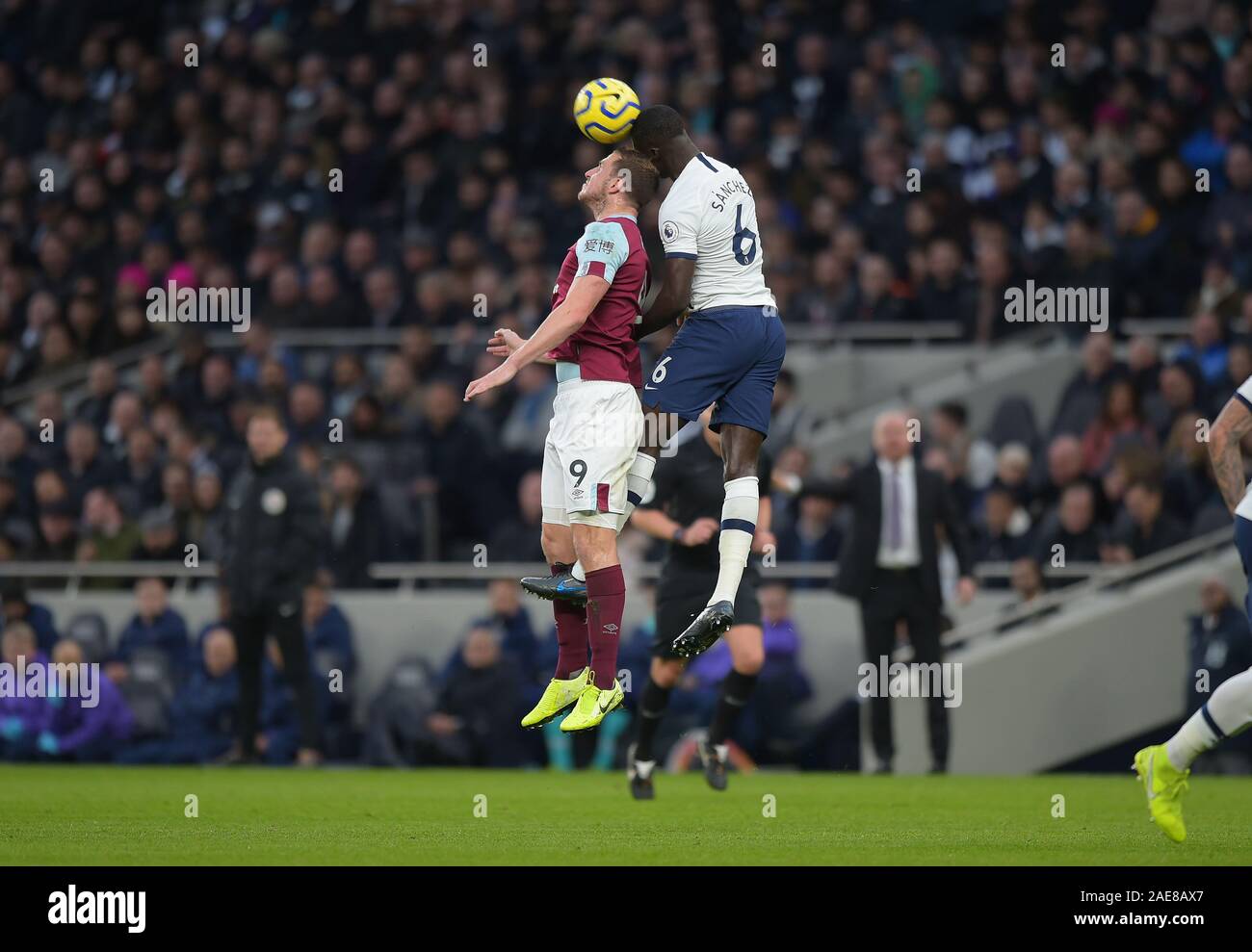 London, UK. 7th December 2019. Davinson Sanchez of Tottenham Hotspur and Chris Wood of Burnley during the Tottenham Hotspur vs Burnley Premier League Football match at the Tottenham Hotspur Stadium on 7th December 2019-EDITORIAL USE ONLY No use with unauthorised audio, video, data, fixture lists (outside the EU), club/league logos or 'live' services. Online in-match use limited to 45 images (+15 in extra time). No use to emulate moving images. No use in betting, games or single club/league/player publications/services- Credit: Martin Dalton/Alamy Live News Stock Photo