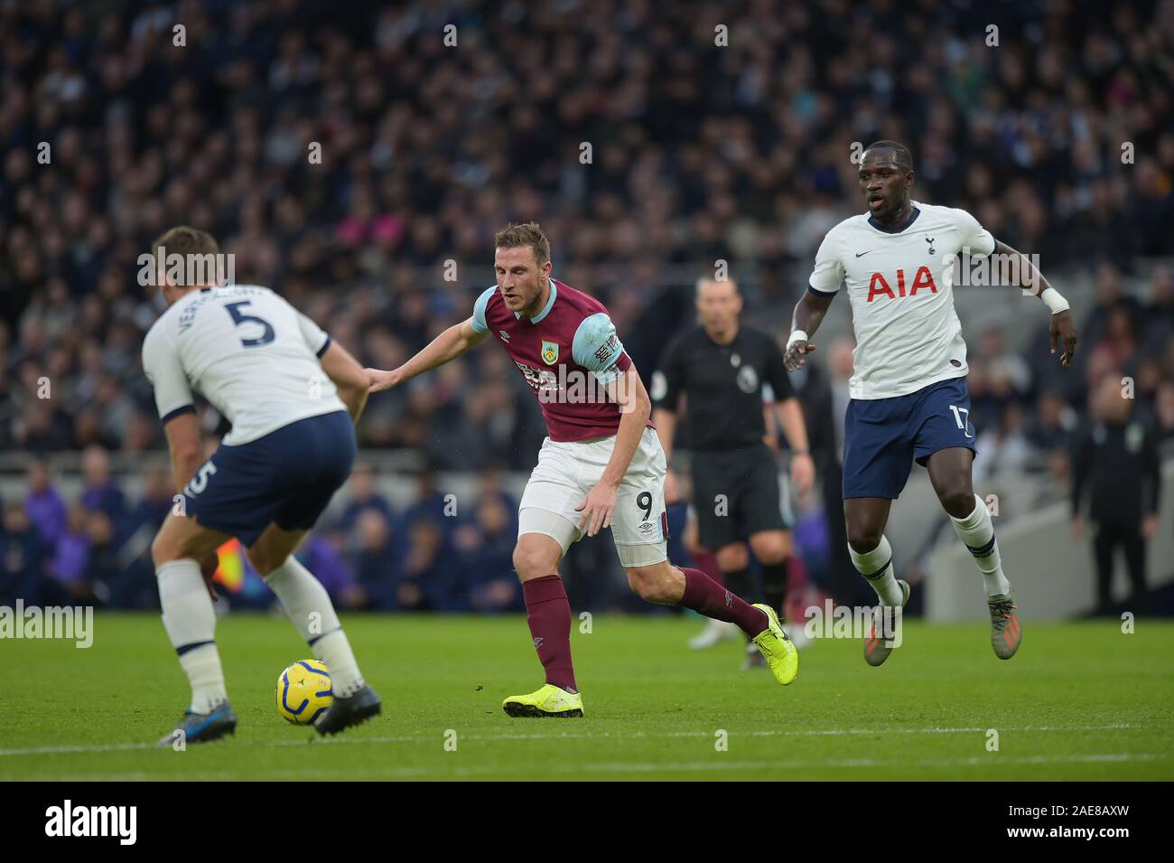 London, UK. 7th December 2019. Chris Wood of Burnley runs at the Spurs defence during the Tottenham Hotspur vs Burnley Premier League Football match at the Tottenham Hotspur Stadium on 7th December 2019-EDITORIAL USE ONLY No use with unauthorised audio, video, data, fixture lists (outside the EU), club/league logos or 'live' services. Online in-match use limited to 45 images (+15 in extra time). No use to emulate moving images. No use in betting, games or single club/league/player publications/services- Credit: Martin Dalton/Alamy Live News Stock Photo