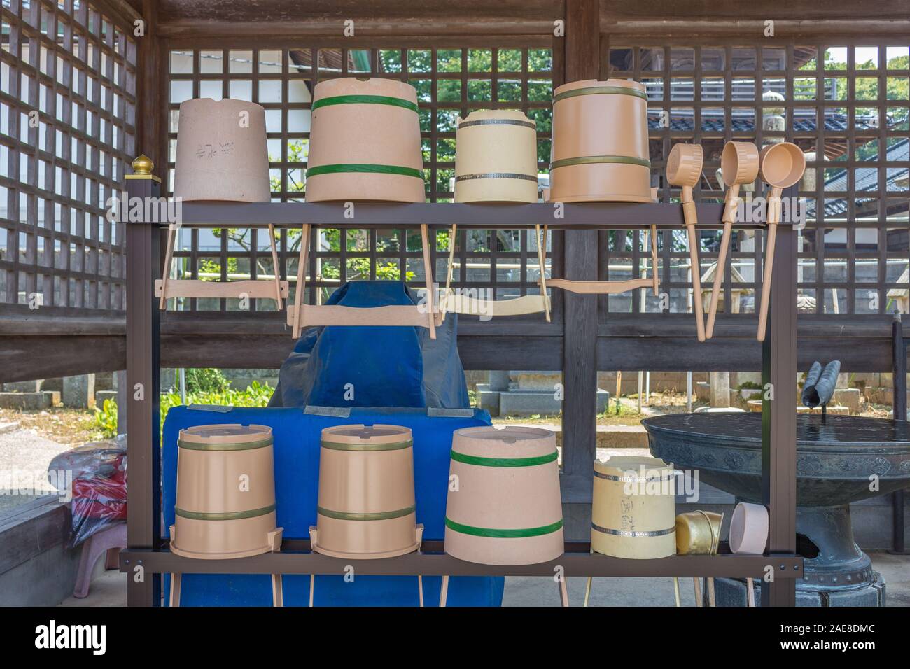 Rack containing traditional water basins, or sukubai , and ladles, or ...