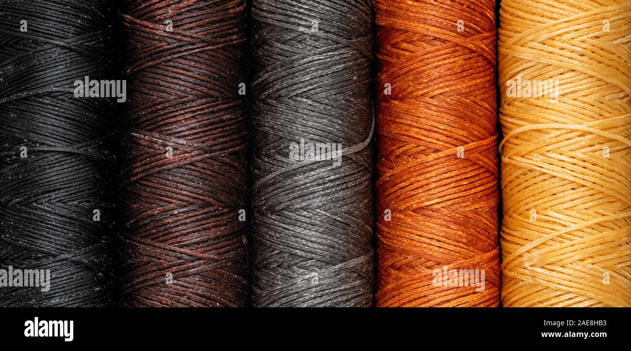 Waxed colorful sewing threads horizontal closeup full frame texture ...