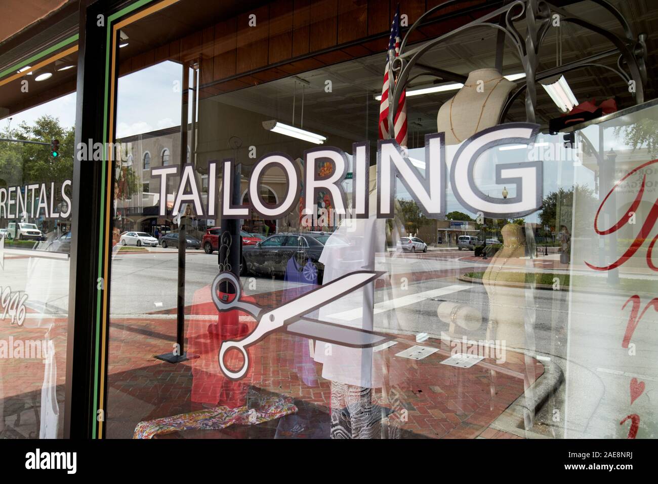 tailoring sign in the window of a haberdashery shop in kissimmee florida usa Stock Photo