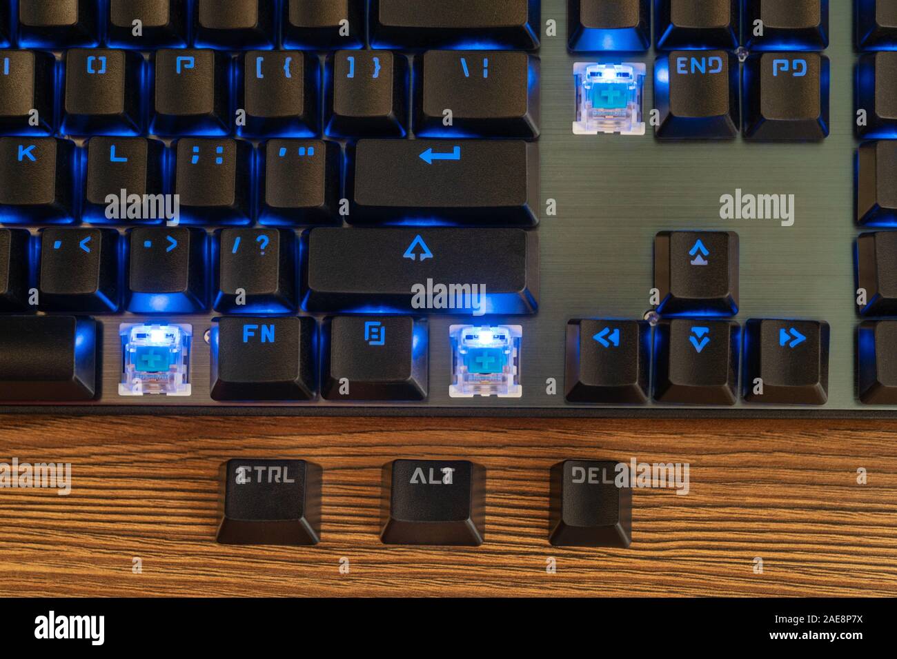 Three keys Control Alt Delete lie next to the black keyboard on the