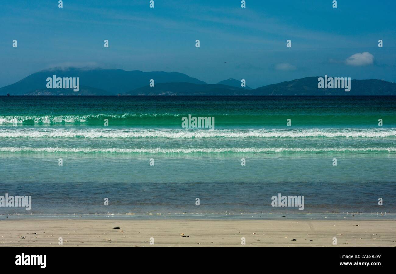 Crystal clear blue water on a desert tropical beach Stock Photo - Alamy
