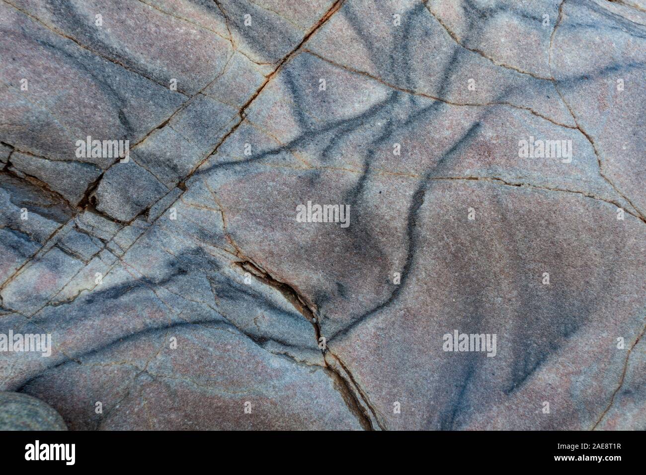 Streak rock texture, cracked and mottled Stock Photo - Alamy
