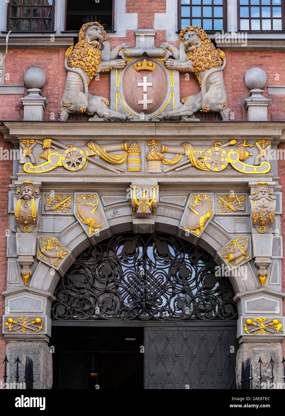 Beautiful decorated in gold, historic door portal of Great Arsenal in Gdansk, Poland Stock Photo