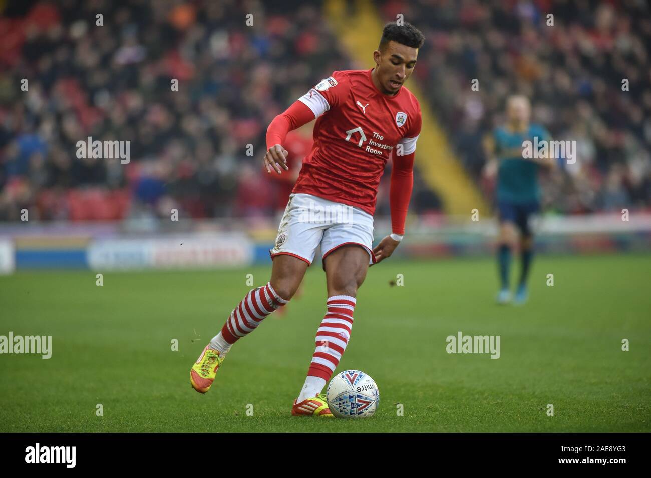 30th November 2019, Oakwell, Barnsley, England; Sky Bet Championship, Barnsley v Hull City :Jacob Brown (7) of Barnsley FC runs down the wing in the Yorkshire derby match. Credit: Dean Williams/News Images Stock Photo