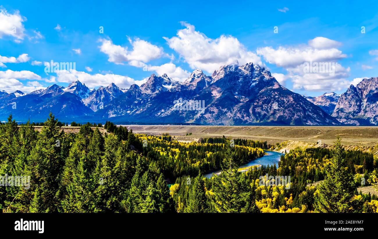 The peaks of The Grand Tetons behind the winding Snake River viewed ...