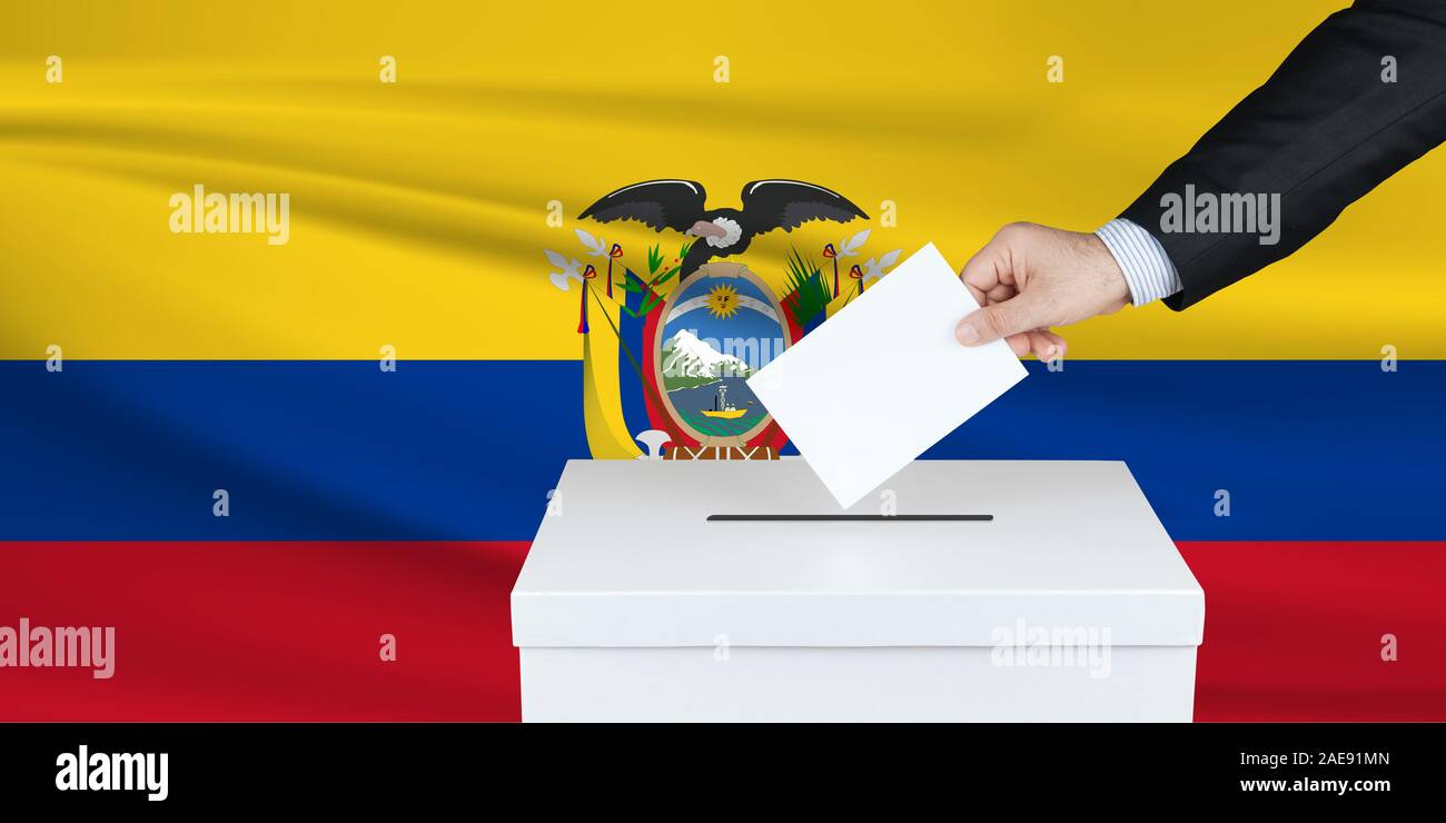 Election in Ecuador. The hand of man putting his vote in the ballot box. Waved Ecuador flag on background. Stock Photo