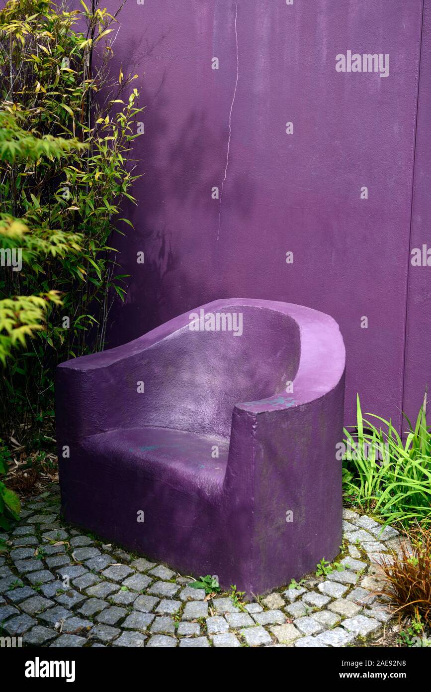 purple armchair,seat,seating,garden feature,concrete,stone,funky,eclectic,garden design,gardens,RM floral Stock Photo