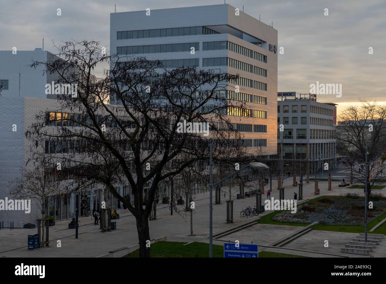 Wolfsburg, Germany - Dec 5th 2019: Wolfsburg street view is calm during twilight. Even when people are preparing for seasonal shopping. Stock Photo
