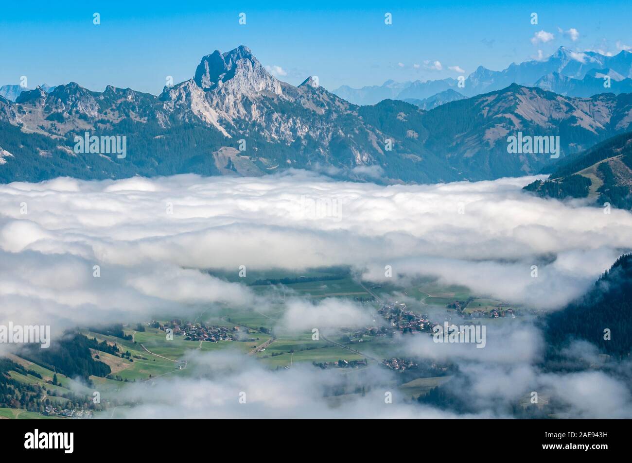 View of Tannheimer Tal, Tannheim Valley, Mt Gimpel, Mt Rote Flueh, Mt Koellenspitze or Kellenspitze at back, high fog, seen from Mt Kuehgundruecken ne Stock Photo