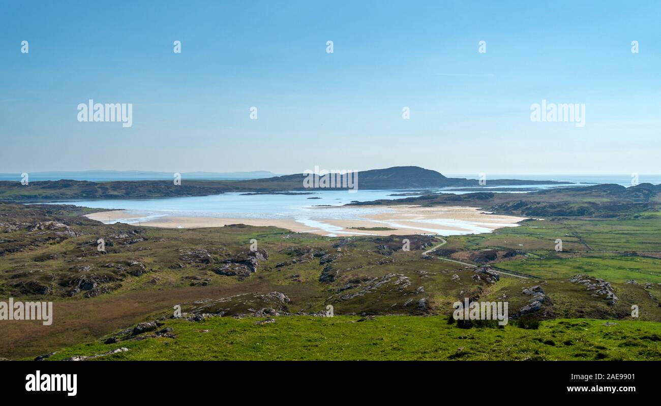 Commanding view from the ancient Dun Cholla hill fort looking over the sands of The Strand to the tidal island of Oronsay, Isle of Colonsay, Scotland Stock Photo