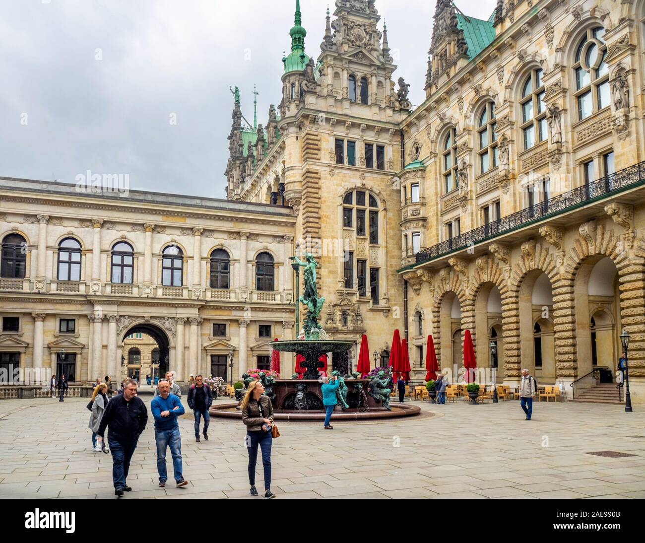 Tourists walking in the courtyard of Rathaus City Hall Hamburg Germany Stock Photo