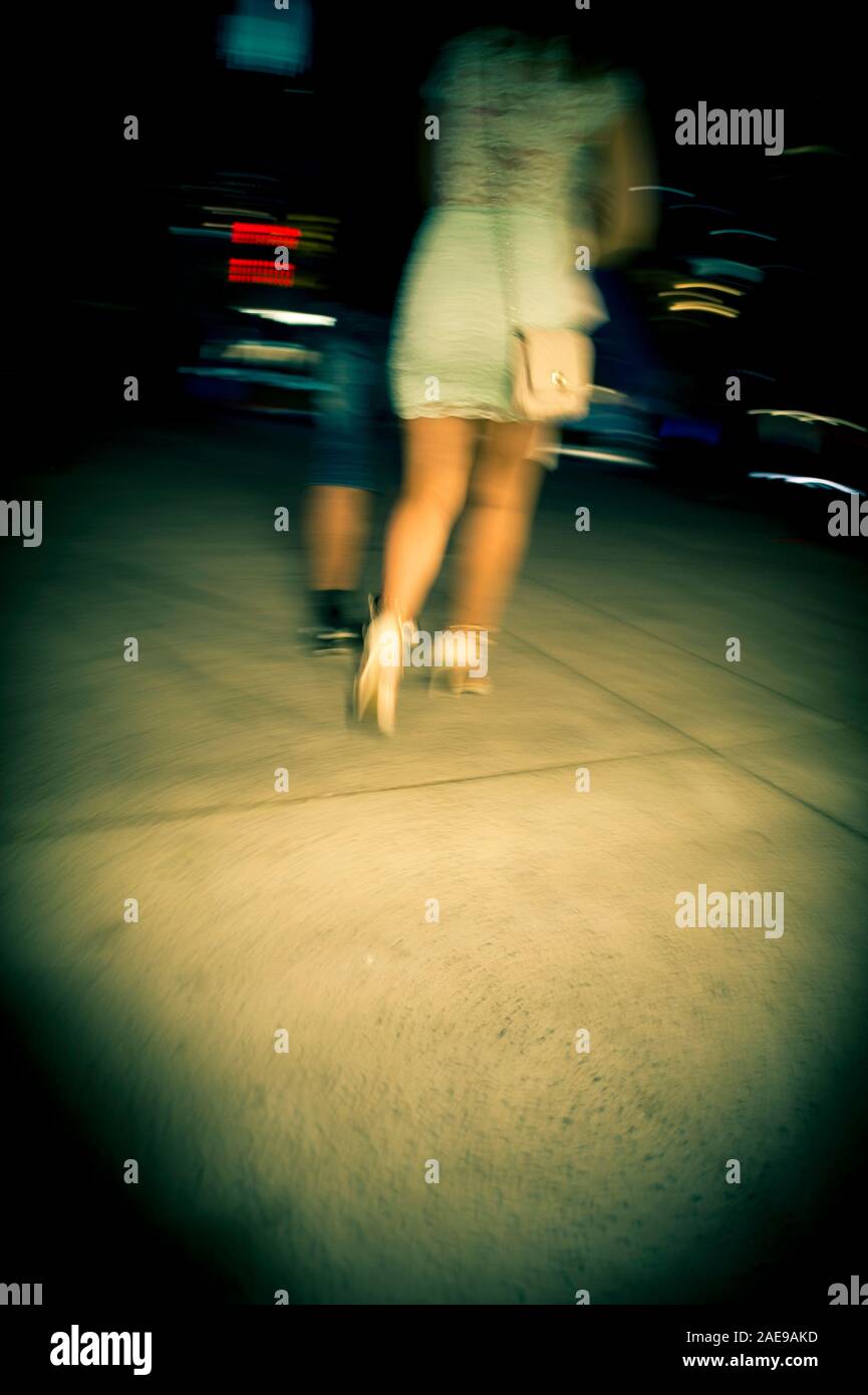 Woman back view dark street hi-res stock photography and images - Alamy